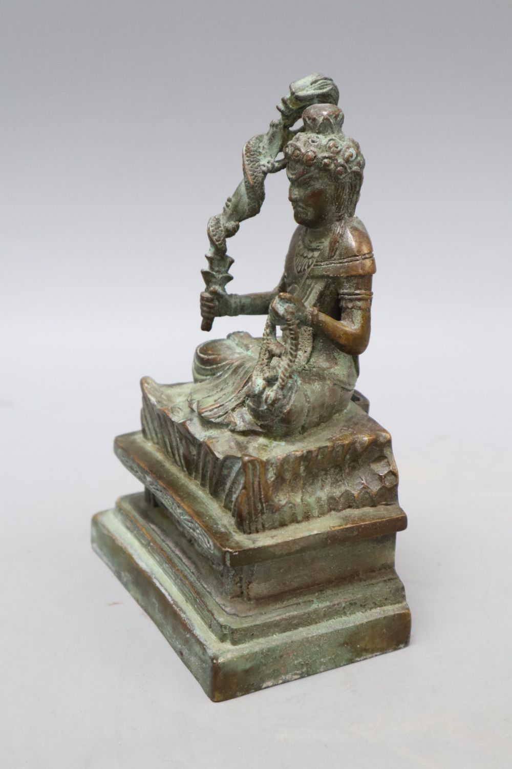 A Himalayan bronze seated figure of a deity, height 16cm